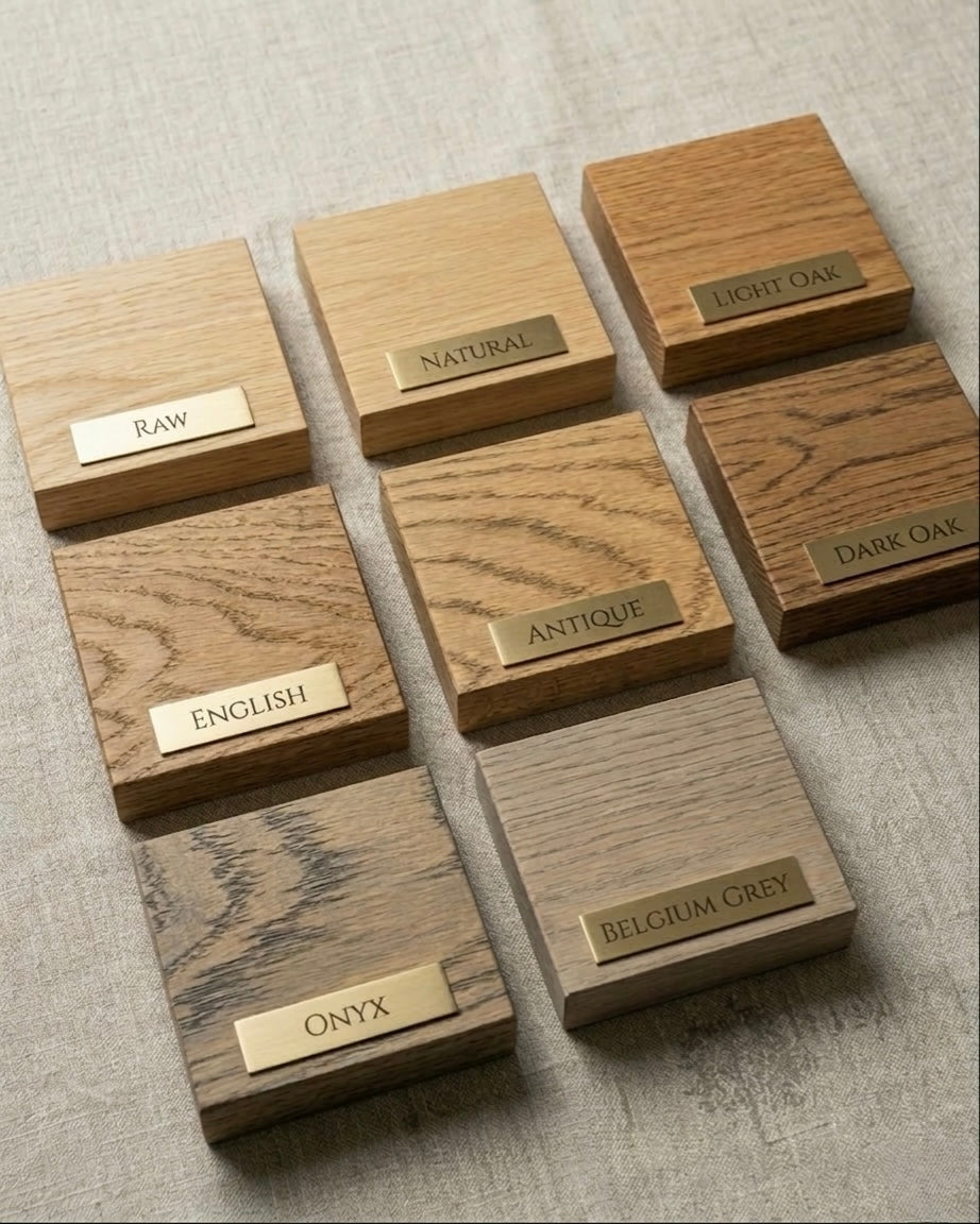 Wooden samples with labeled finishes on a textured surface