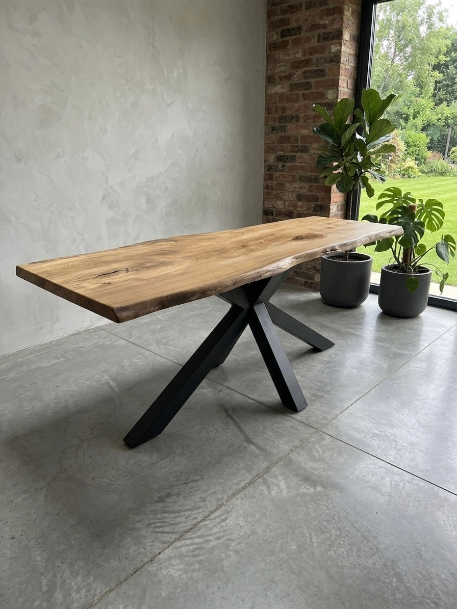 Wooden dining table with black metal legs in a modern interior setting.