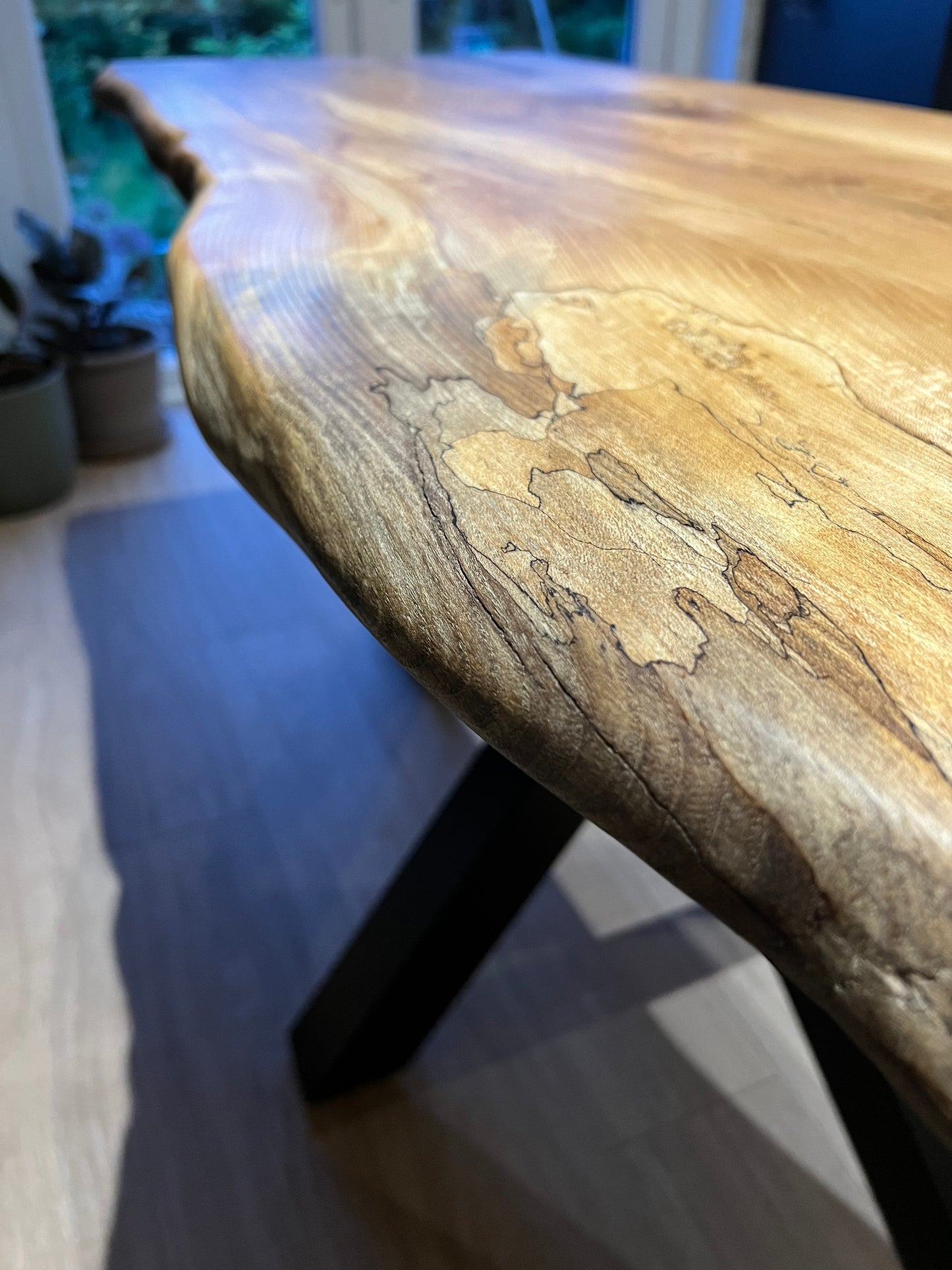 Close-up of a wooden surface with a blurred background